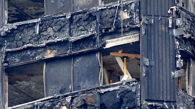 The charred remains of cladding are pictured on the outer walls of the burnt out shell of the Grenfell Tower block in north Kensington, west London. Picture: Niklas Halle’n