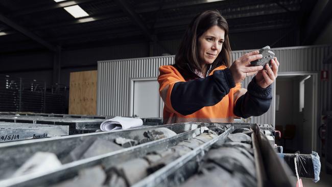 Snowy Hydro geotechnical engineer Emilie Lapointe with some of the 22km of stone core samples taken as part of the initial works of Snowy 2.0. Picture: Rohan Thomson