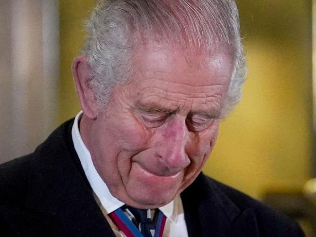 Britain's King Charles III reacts after unveiling statues of late Britain's Queen Elizabeth and late Britain's Prince Phillip upon his arrival to attend "The Royal British Legion Festival of Remembrance" at Royal Albert Hall, in London, on November 11, 2023 as part of the Remembrance Day commemorating the end of World War I. (Photo by MAJA SMIEJKOWSKA / POOL / AFP)