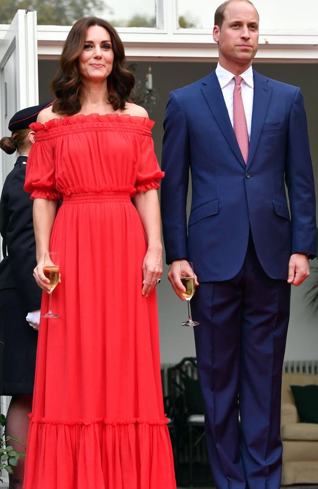 Kate turned heads in this scarlet-red Alexander McQueen frock in Berlin (and note the colour of Wills’ tie). Picture: AFP