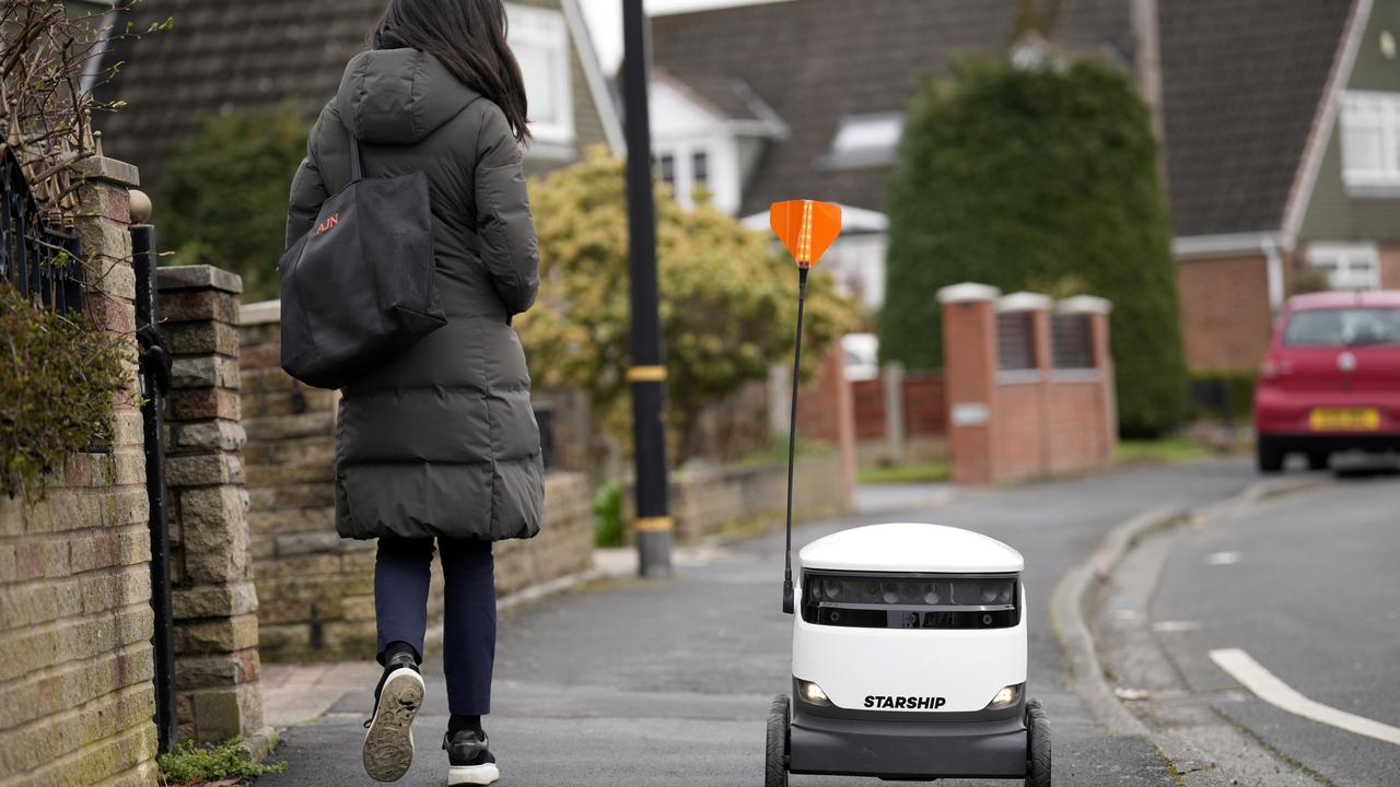 A Starship Technologies robotic vehicle delivers groceries to customers in Manchester, England last week. Picture: Getty Images