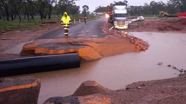 Highway to Charters Towers cut at Mingela truck rest, with a Roadtek crew working hard to fix it and get it opened again on Wednesday.