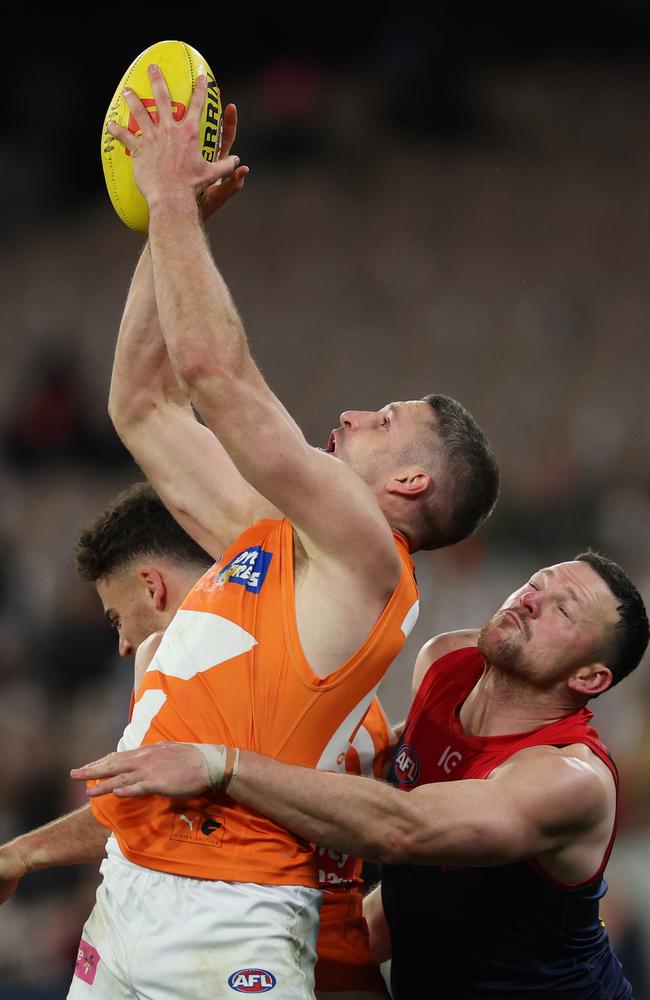 Jesse Hogan marks in front of Demon Steven May. Picture: Daniel Pockett/Getty Images