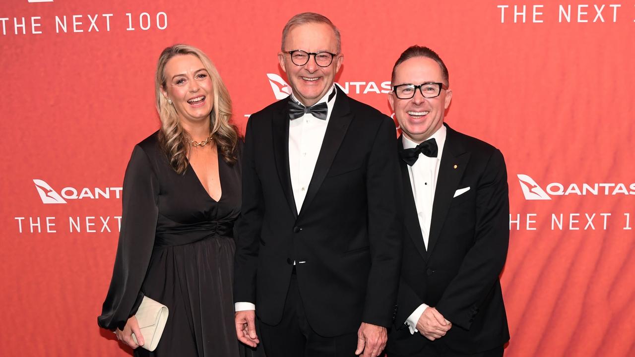 Anthony Albanese with his partner Jodie Haydon and Qantas CEO Alan Joyce as they attend the Qantas 100th Gala Dinner at Jetbase 96 hangar at Sydney's International Airport on March 31, 2023. (Photo by James D. Morgan/Getty Images)