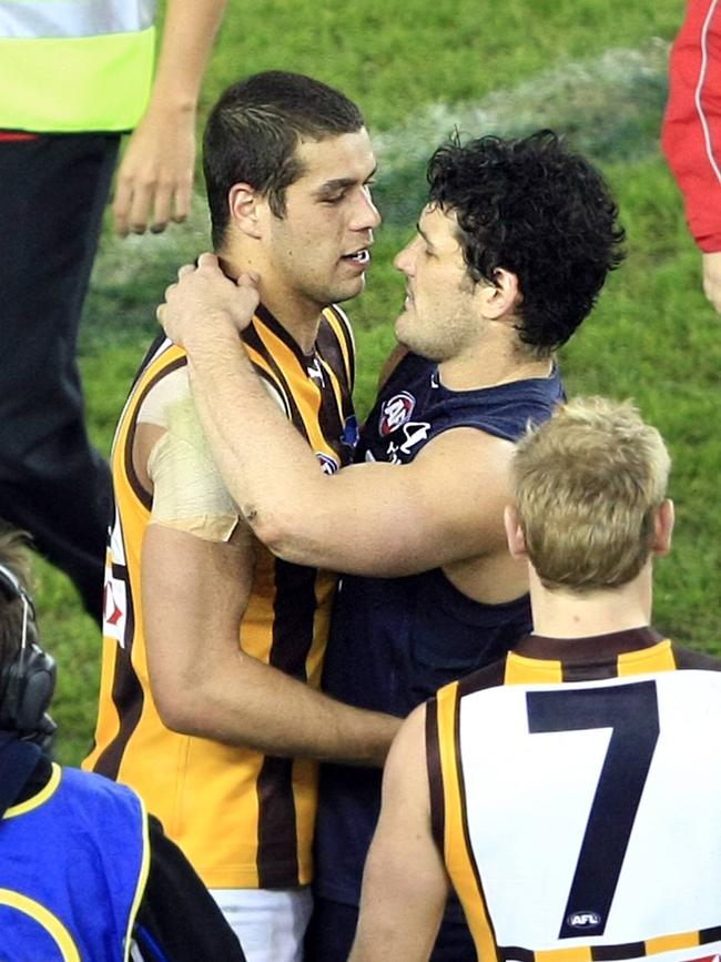 Brendan Fevola congratulates Lance Franklin on his milestone 