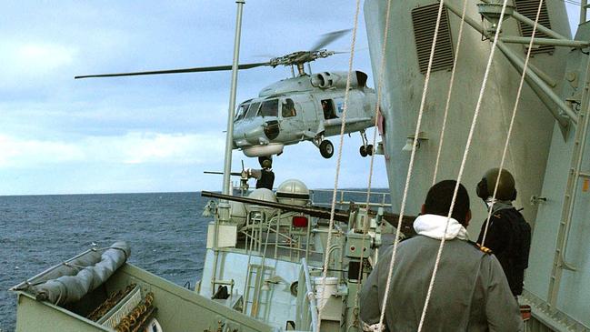 RAN Seahawk helicopter leaving Australian Navy Ship HMAS Stuart during interception.