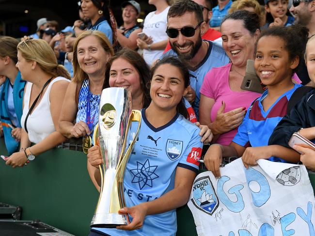 Teresa Polias of Sydney poses for photographs with supporters following her team's win over the Glory in the W-League grand final between Sydney FC and Perth Glory at Netstrata Jubilee Stadium in Sydney, Saturday, February 16, 2018. (AAP Image/Dan Himbrechts) NO ARCHIVING, EDITORIAL USE ONLY