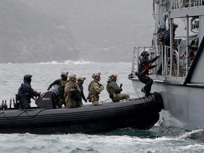 SYDNEY, AUSTRALIA - NewsWire Photos  SEPTEMBER 26, 2024:  Military and police personnel board the HMAS Gascoyne as part of boarding exercises. Personnel from Australian Defence Force, Japan, Republic of Korea and the United States as well as the Australian Federal Police and New South Wales Police Force work together in ship boarding exercises and training as part of Exercise Pacific Protector.   Picture: NewsWire / John Appleyard