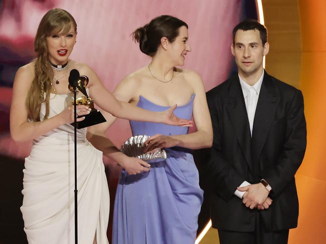 Swift and Antonoff - with Laura Sisk in the middle - accept the Grammy for 2024 Album of the Year. Picture: Kevin Winter/Getty Images for The Recording Academy