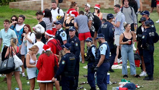 Rubbish could be seen strewn across the grass as police moved in on the crowd. Picture: Toby Zerna