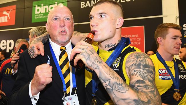 Dustin Martin shares a beer with Rex Hunt.