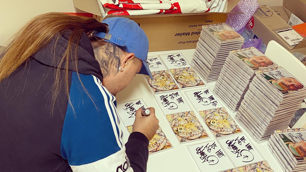 Trent Pedrana autographing his albums.