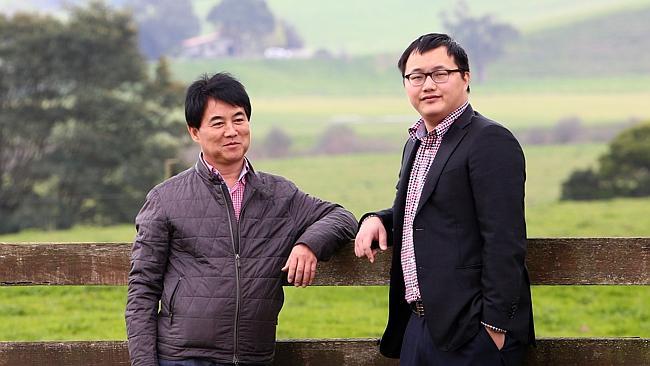 Harry Wang, right, with Ningbo president Yin Chong Zhang. Picture: Aaron Francis.