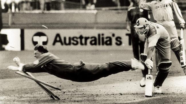 Jonty Rhodes dives full length at the stumps to run Pakistan's Inzamam ul-Haq during World Cup Cricket at the Gabba in 1992.
