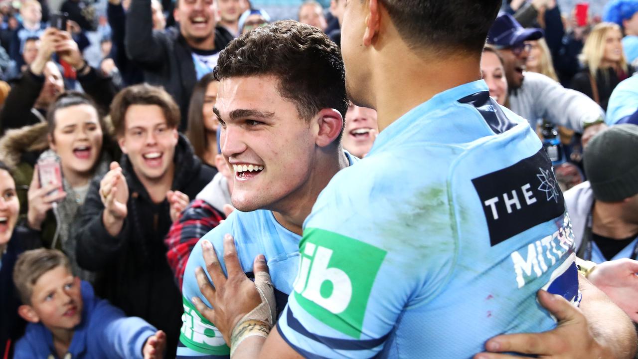 Nathan Cleary and Latrell Mitchell of the Blues celebrate victory after game two of the State of Origin series at ANZ Stadium.