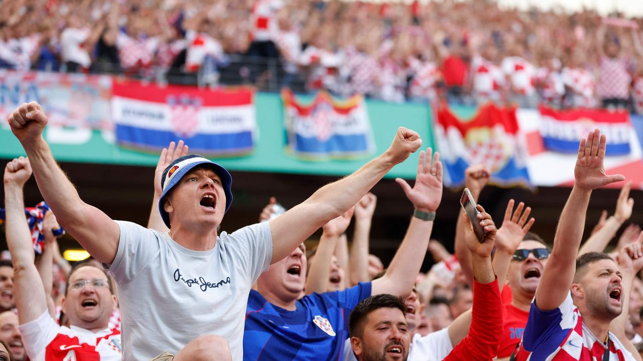 Supporters of Croatia cheer during the UEFA Euro 2024 Group B football match between Croatia and Albania. (Photo by Odd ANDERSEN / AFP)