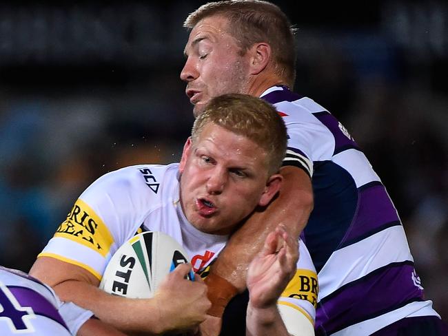 TOWNSVILLE, AUSTRALIA - MARCH 30: Ben Hannant of the Cowboys Ryan Hinchcliffe and Kurt Mann of the Storm during the round four NRL match between the North Queensland Cowboys and the Melbourne Storm at 1300SMILES Stadium on March 30, 2015 in Townsville, Australia. (Photo by Ian Hitchcock/Getty Images)