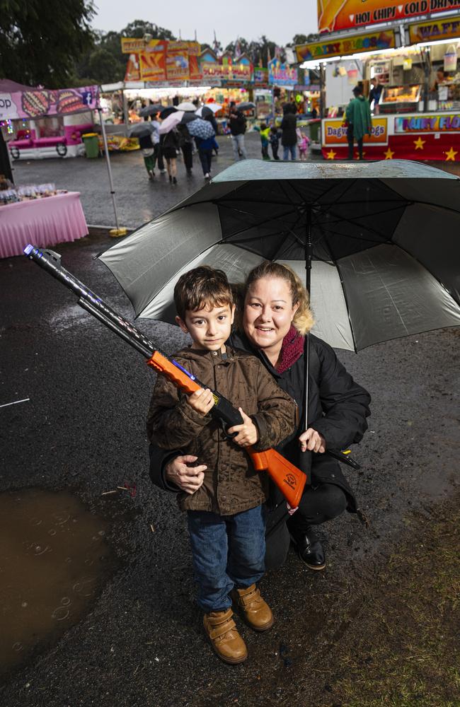 Onyx and Cheryl Spencer with a toy gun at the Toowoomba Royal Show, Saturday, April 20, 2024. Picture: Kevin Farmer