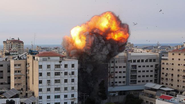 Fire and smoke rise after an Israeli air strike targeted the National Bank in Gaza, after Palestinian militant group Hamas launched a massive surprise assault on Israel. Picture: AFP