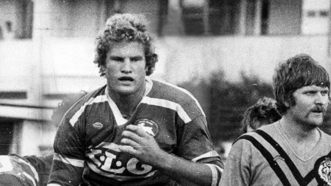 Souths Charlie Frith towers over a Balmain opponent.