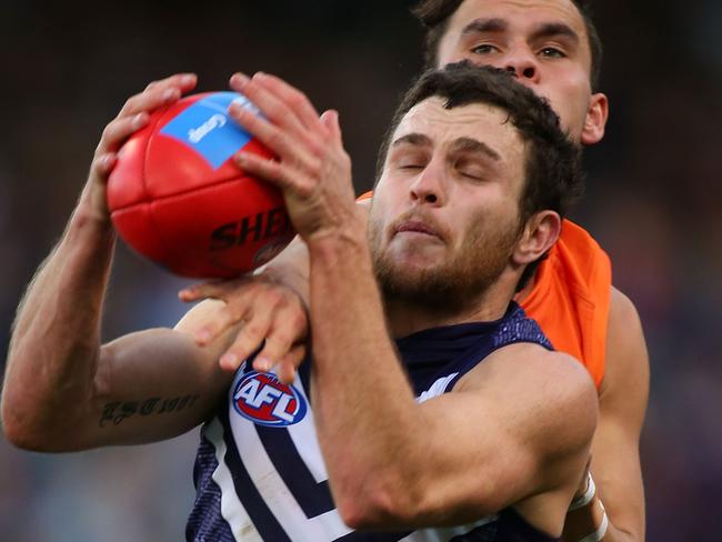 Fremantle’s Hayden Ballantyne marks in front of the Giants’ Zac Williams. Picture: Paul Kane