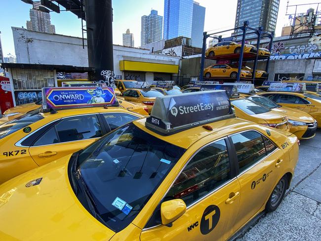 Taxis are parked in a car park in Manhattan. Most cabdrivers are fearful of being exposed to the coronavirus that they prefer to stay home with no way to pay bills. Picture: Getty Images/AFP