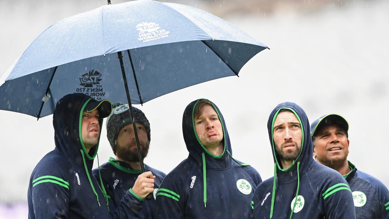 Ireland players watch on as rain falls on Friday.