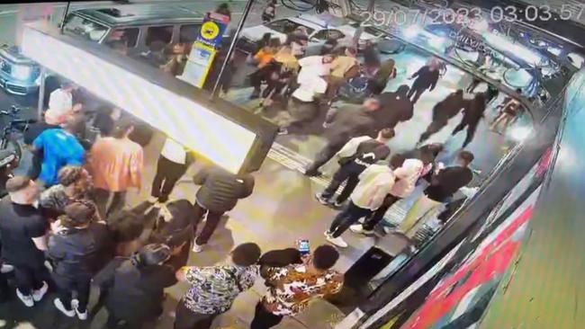 A man was pushed away from the fracas before he sprinted away across the street (top left). Picture: NCA NewsWire