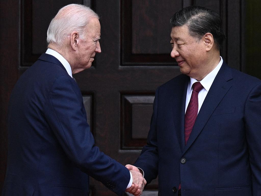 (FILES) US President Joe Biden greets Chinese President Xi Jinping before a meeting during the Asia-Pacific Economic Cooperation (APEC) Leaders' week in Woodside, California on November 15, 2023. China has freed three Americans considered wrongfully detained in a swap with the United States, US officials said on November 27, 2024, meeting a key goal of outgoing President Joe Biden's administration. The three Americans -- Mark Swidan, Kai Li and John Leung -- were the last prisoners in China classified by the State Department as wrongfully detained, although activists and families have raised the cases of other US citizens. (Photo by Brendan SMIALOWSKI / AFP)