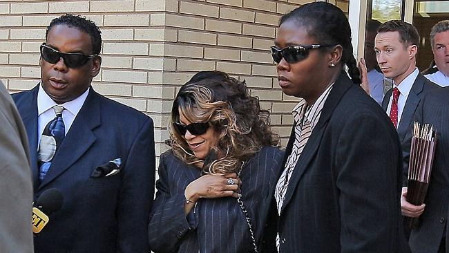 Tyka Nelson and her lawyers leave the hearing on Prince’s estate on Monday. .