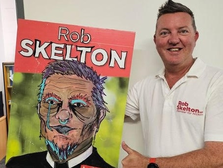 Labor's Nicklin MP Rob Skelton with his art-affected corflutes – Photo Supplied