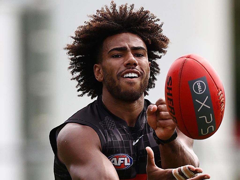 Isaac Quaynor flicks out a handball. Picture: Michael Klein