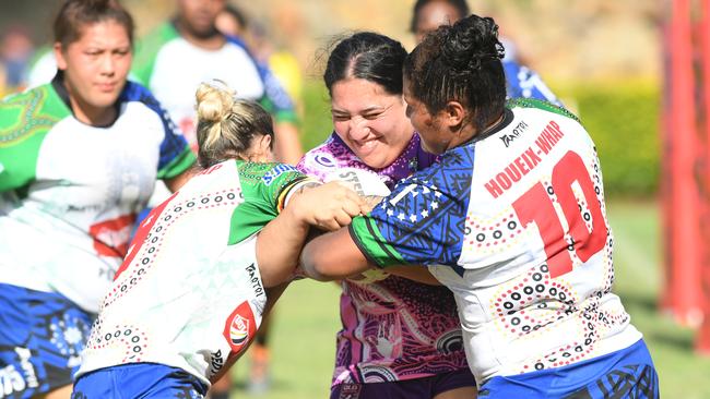 Emu Park's Rima Butler is met by some solid FNQ Stingers defence.