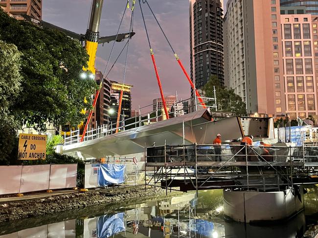 A crane lowers the first span into place. Source: Brisbane City Council.