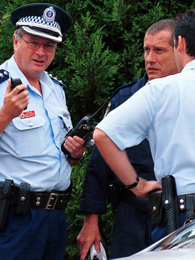 Police Chief Inspector Greg Ashurst (left) outside Courtney Morley-Clarke's Point Clare during the search for her body. Picture: Ron Hutchings