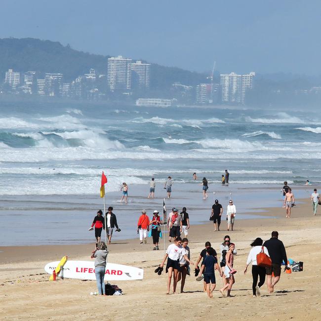 Surfers Paradise wakes up to its first day in lockdown due to the latest Covid-19 scare. Crowds walking around Surfers Paradise without masks. Picture Glenn Hampson
