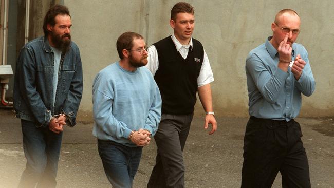 Mark Ray Haydon, John Justin Bunting and Robert Joe Wagner in handcuffs in 2000. Picture: Supplied