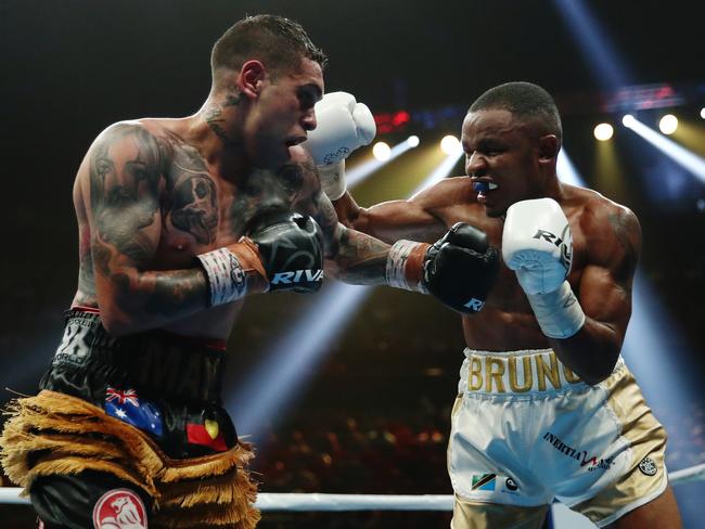 Bruno Tarimo and Nathaniel May compete in the Men's Super Featherweight fight during their undercard fight at the International Convention Centre in Sydney, Friday, December 6, 2019. (AAP Image/Brendon Thorne)