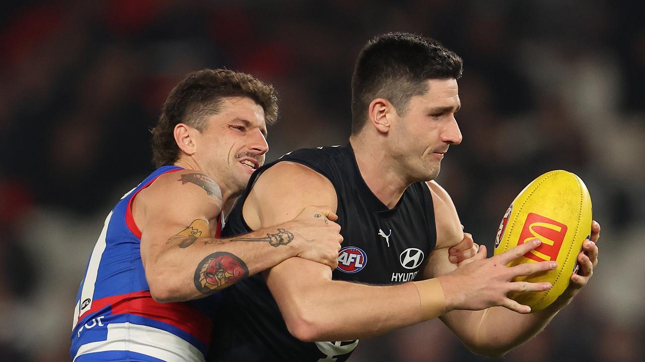 Marc Pittonet tackled by Tom Liberatore.