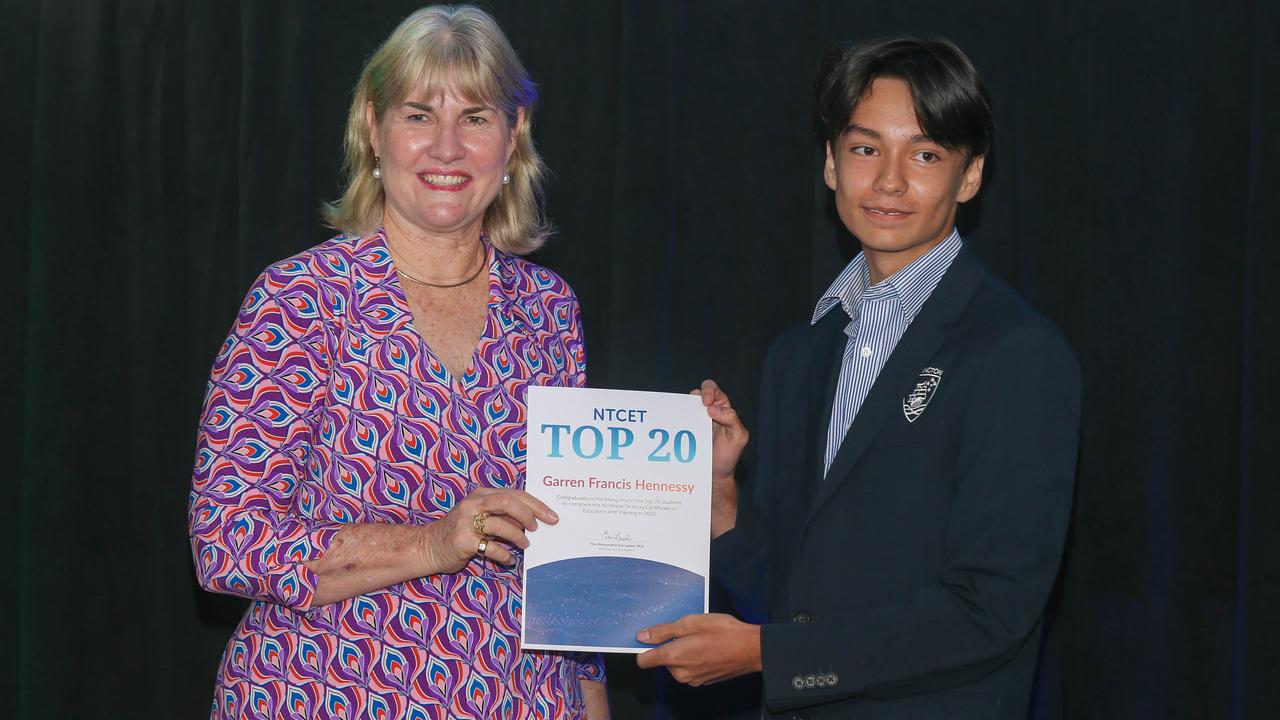 Education Minister Eva Lawler presents Essington School's Darren Hennessy after the announcement of 2022 NTCET Top 20 Year 12 Students and 2022 Top Aboriginal Student at NT Parliament House. Picture: Glenn Campbell