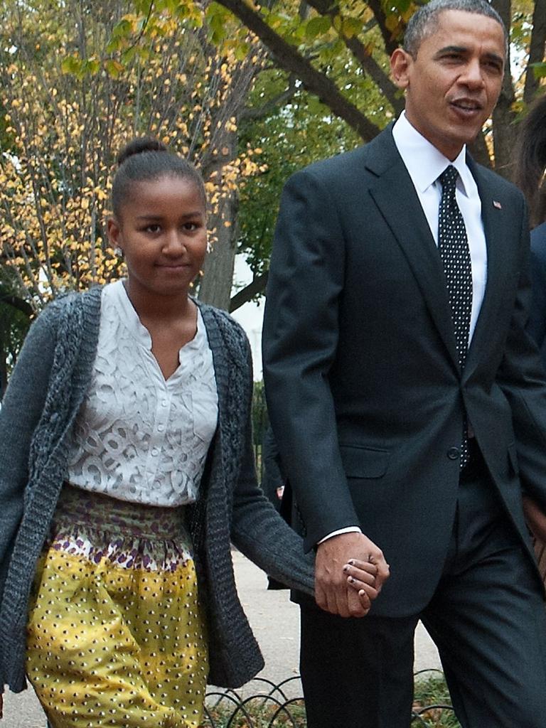 Sasha with her dad. Picture: Nicholas Kamm/AFP