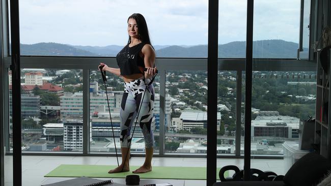 With a usually active social life, Nyari says she exercises on her balcony to keep her spirits up. Picture: Liam Kidston.