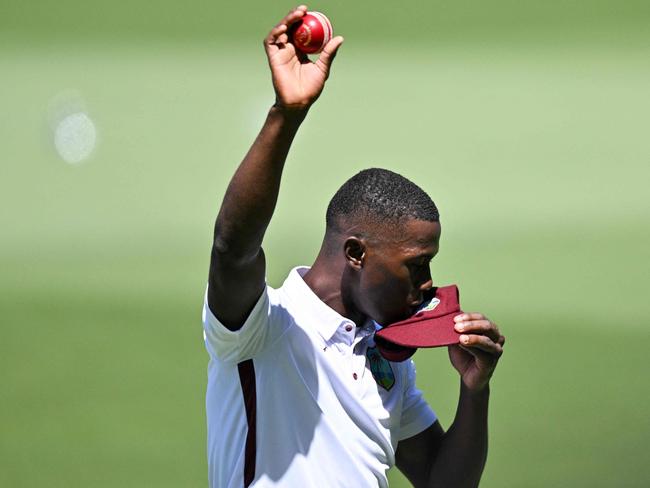 West Indiesâ Shamar Joseph celebrates after taking five wickets during day two of the first cricket Test match between Australia and the West Indies at the Adelaide Oval in Adelaide on January 18, 2024. (Photo by Izhar KHAN / AFP) / -- IMAGE RESTRICTED TO EDITORIAL USE - STRICTLY NO COMMERCIAL USE --
