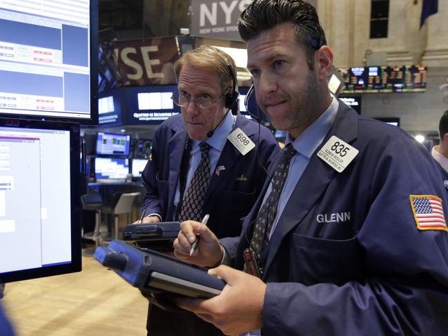 Traders Luke Scanlon, left, and Glenn Kessler work on the floor of the New York Stock Exchange, Wednesday, June 10, 2015. U.S. stocks are opening higher, breaking a weeklong slump. (AP Photo/Richard Drew)