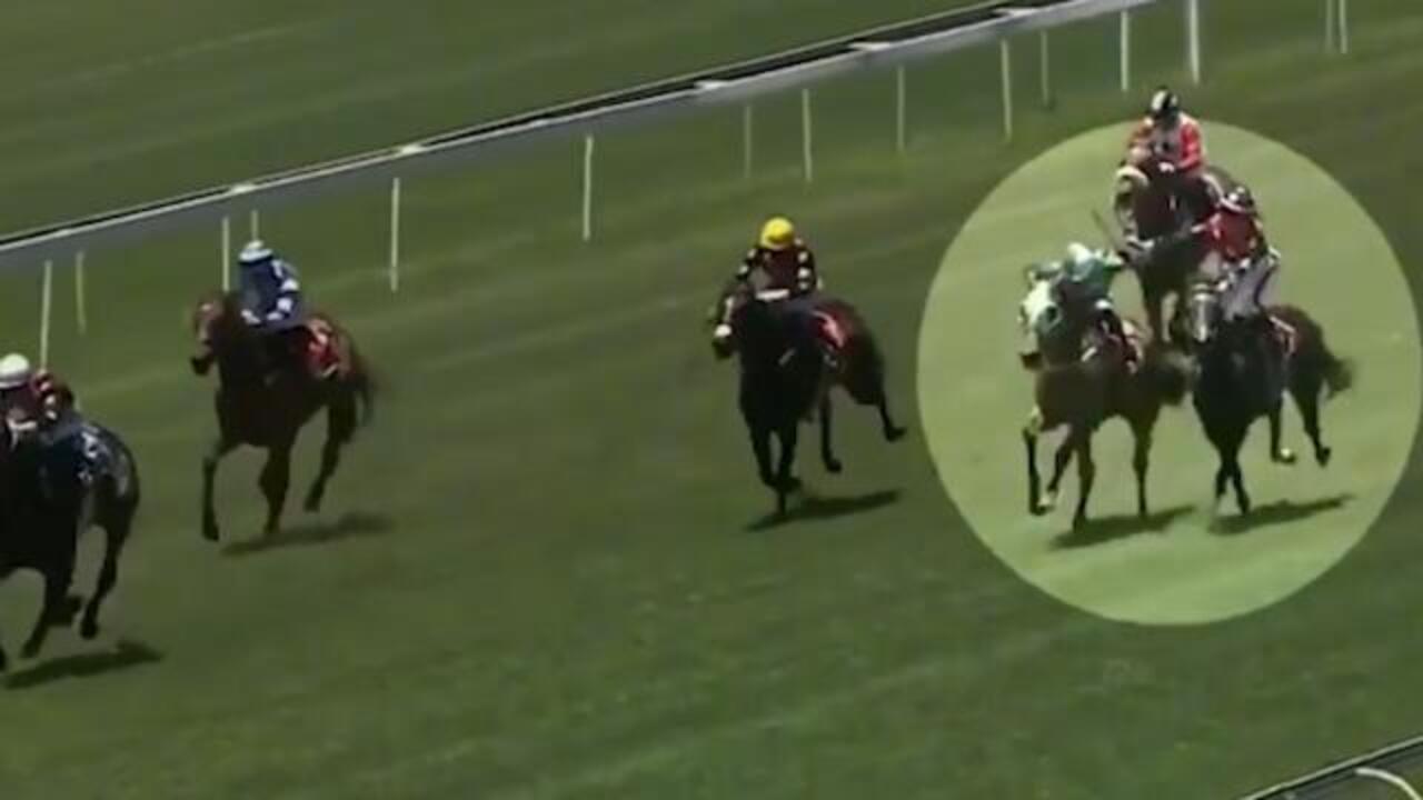 Furious jockey whips rival!