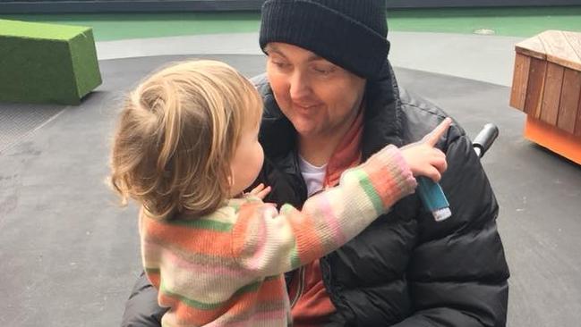 Jarrod Lyle with his daughter while in hospital.