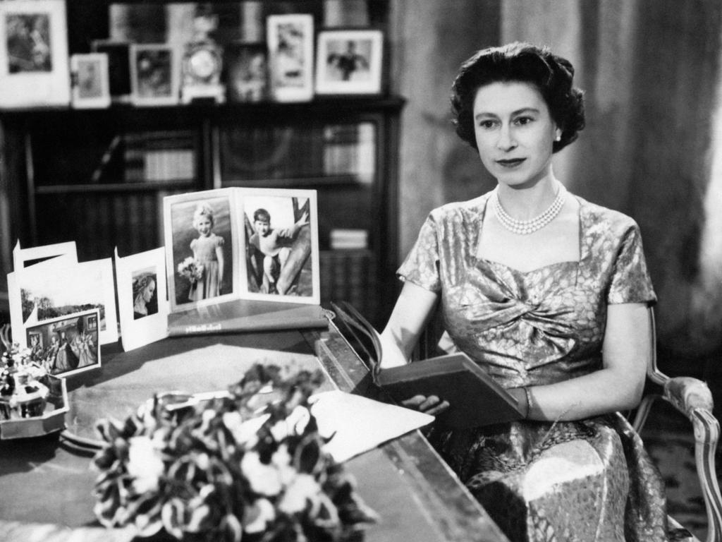 The Queen, in a gold lame dress, is seen in the Long Library at Sandringham shortly after making the traditional Christmas Day broadcast to the nation. She began the tradition in 1957. Picture: PA Images via Getty Images