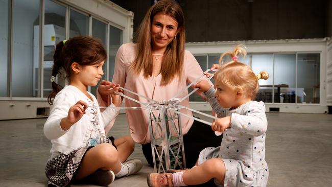 Flavia Tata Nardini is exposing her children Caterina and Vittoria to satellites at an early age in her  warehouse office in Beverley. Picture: MATT TURNER