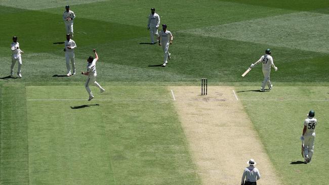 Fast bowler Harshit Rana leaps in the air to celebrate taking the wicket of Nathan Lyon in Australia’s first innings at Perth. Picture: AFP