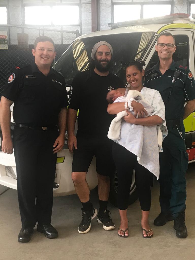 Celebrating the birth of Nocona Rimene on the side of the Cunningham Highway are (from left) QFES Inglewood Acting Lieutenant Alex Johnson, dad Quentin Rimene, mum Sarah Hapi and QAS Inglewood paramedic David Jones.